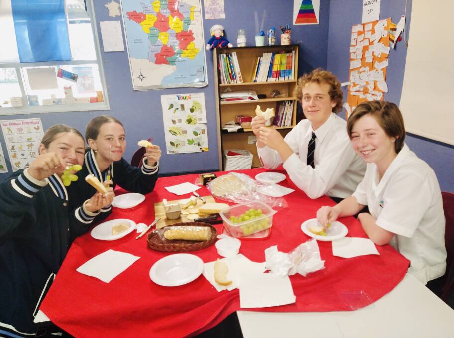 Lucy Woolnough (far right) with her stage 6 French class of St Peter's. 