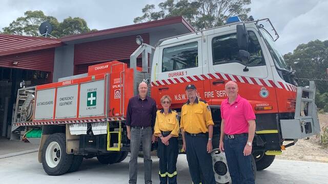 South Durras RFS meet with Telstra's regional manager Chris Taylor to receive three repeaters to help with communication during emergencies. 