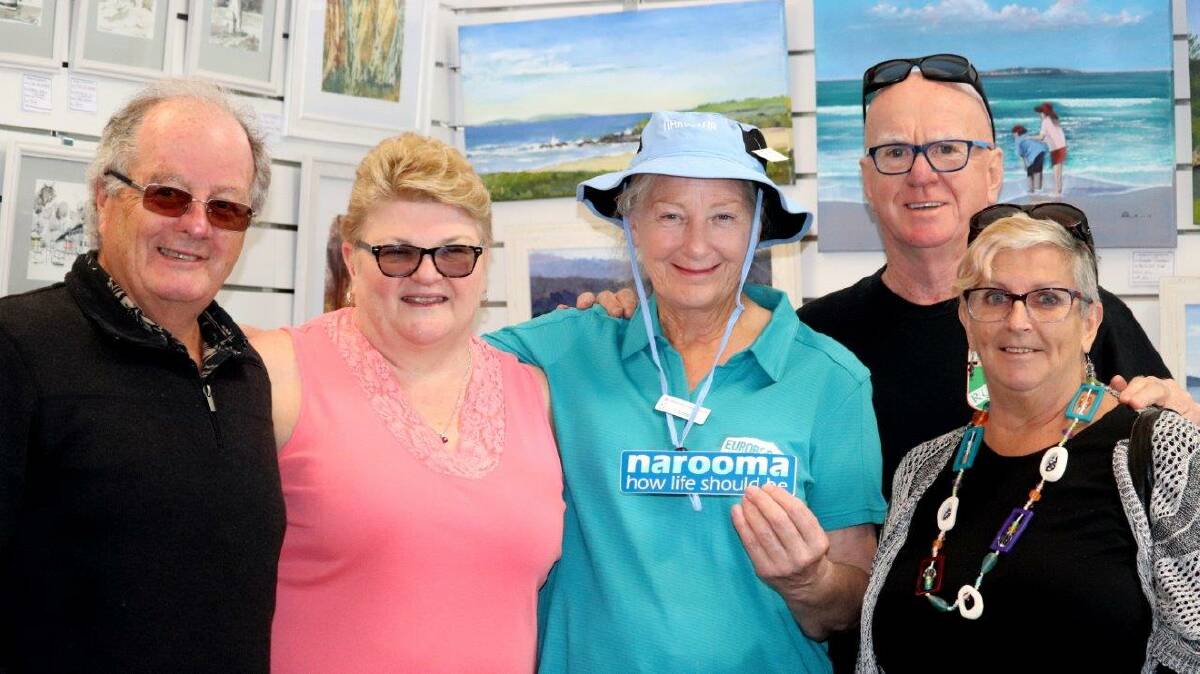 Phillip and Julie Nicoll of Wollongong, pictured at left, stopped by the Narooma Visitor Information Centre while on a driving tour of the Far South Coast with their friends Terry and Cathy Maloney, down from Daintree, Queensland. Local Volunteer Jude Thompson, pictured centre, was pleased to point out local places of interest in the MACS artists gallery at the Information Centre's gift shop.