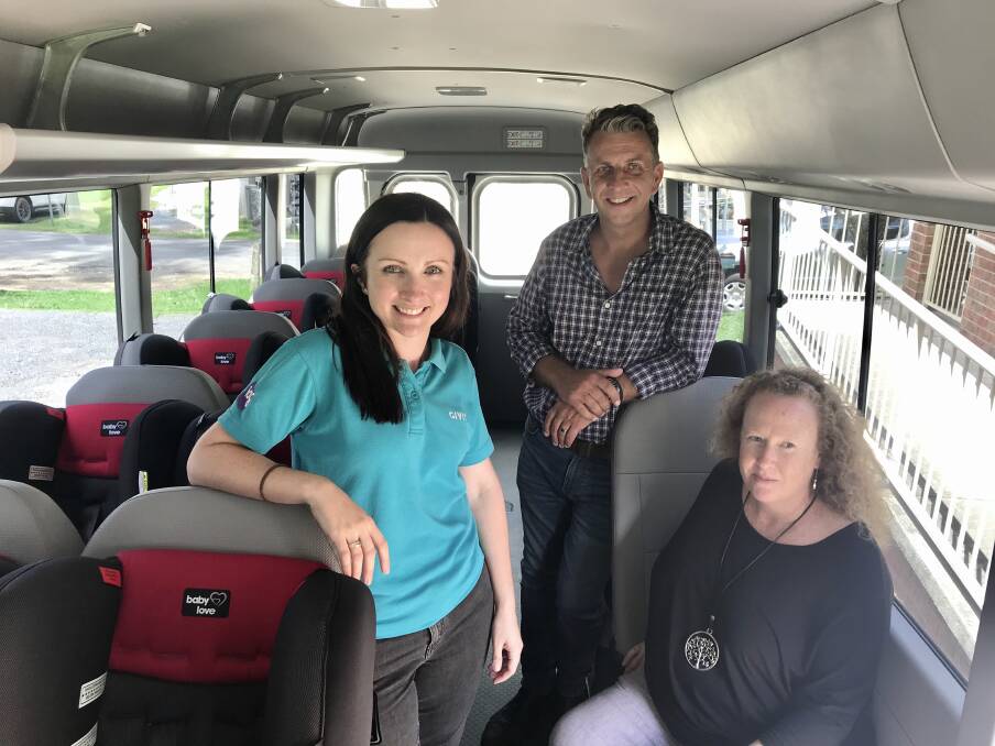 Caroline Odgers, Bega MP Andrew Constance with Janine Hutton of Campbell Page with donated car seats on Mogo Aboriginal Preschool bus.