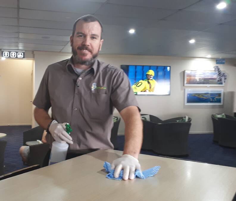 Dean Drysdale of Narooma Golf Club keeps on top of the cleaning whilst looking after customers on Friday, March 20. 