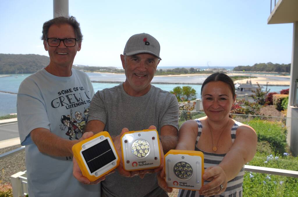 SOLAR BUDDIES: Eurobodalla Shire Councillor Lindsay Brown, Shaun Martyn of FairBreak and Mary Dullard of Origin Energy have teamed up to bring SolarBuddy lights to the South Coast. 