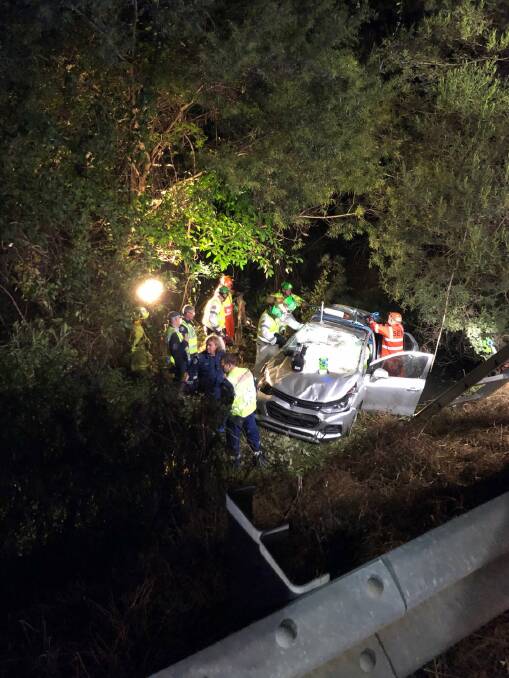 LUCKY: Emergency services rescue Lynette Williams from a Holden Trax SUV in Kianga Creek on Thursday, June 6. Picture: Fire and Rescue NSW.