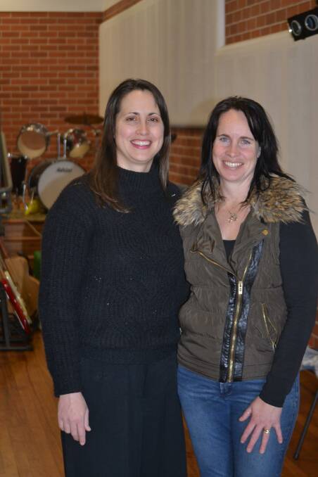 For the love of music: Music teacher Michelle Garcia and roadie Katrina White can't wait to see a lively audience fill the Narooma Public School Hall next week. 
