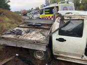 A white ute rolled when driving on wet road on Saturday, July 6. Picture: Moruya Fire and Rescue Facebook page. 