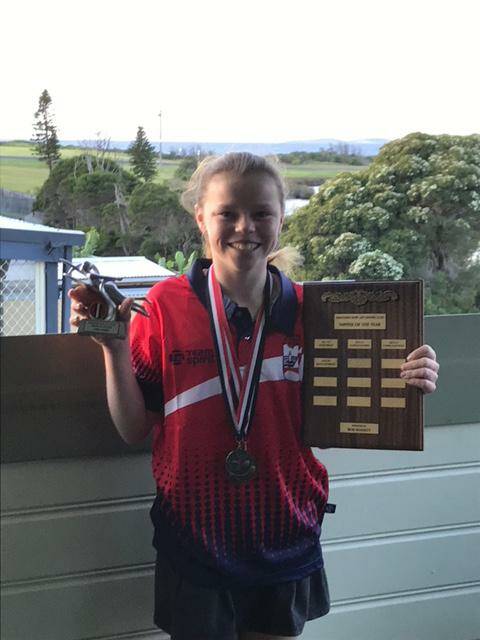 Surf club star: Narooma Surf Lifesaving Club's Nipper of the Year, Sara James. She is holding the perpetual Bob Bennett Shield and trophy for sportsmanship.
