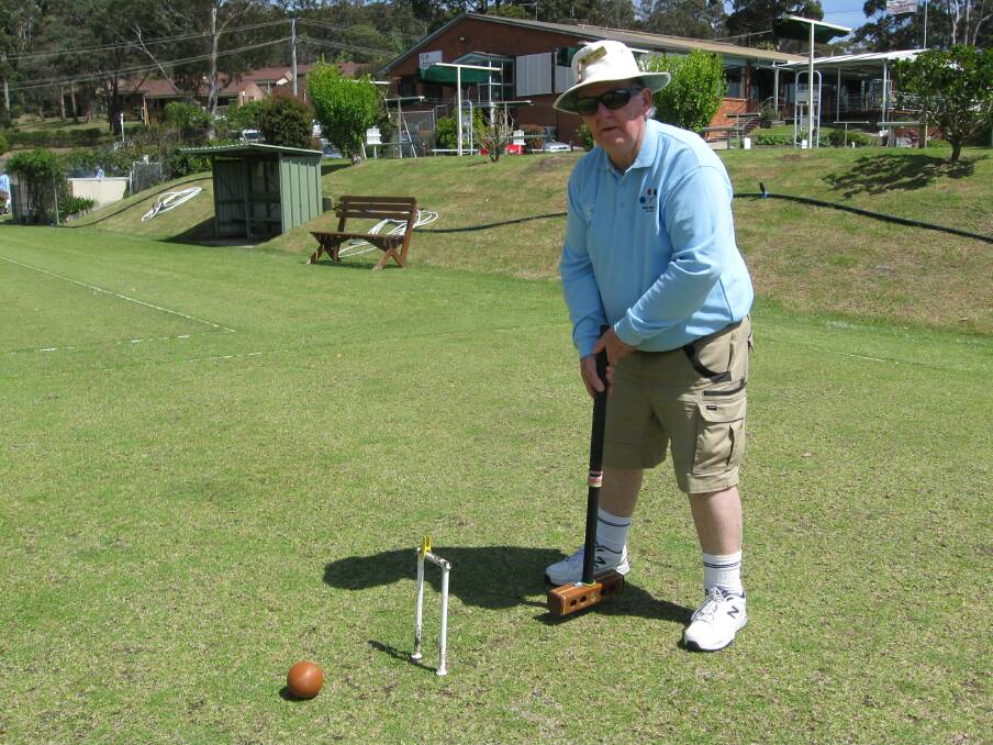 Len Favier scores with the brown ball in game 3 of ricochet croquet