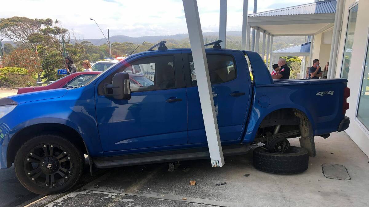Damage to a vehicle and the Wharf Apartments building. Image: Narooma Fire and Rescue.