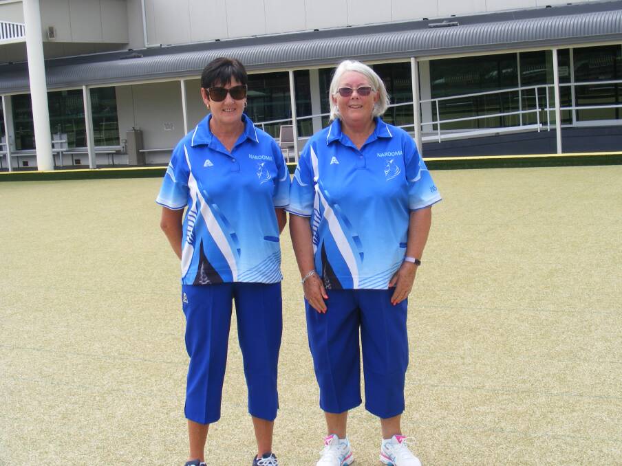 Julie Smith congratulates the winner of the Narooma Women's Bowls Club Minor Singles, Cindy Newell.