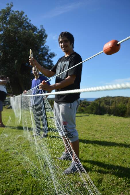 Revive culture: Youth of the Bingie/Moruya men's group use materials such as cork and led line to make a fishing net. The net-making program started at Wallaga Lake.