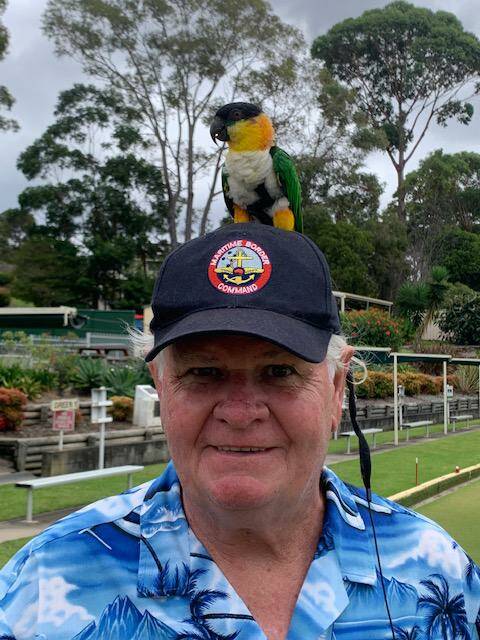Johnny Cairns and his parrot, visitors to Narooma from Manly Croquet Club.