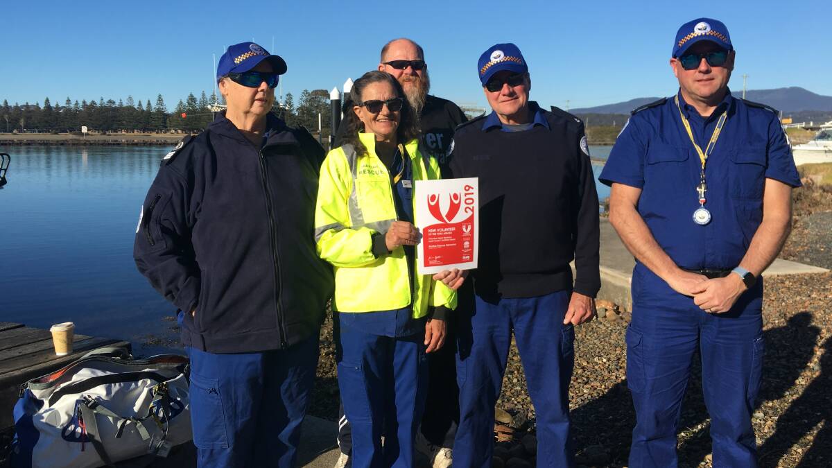 Narooma Marine Rescue's boat crew members Julia Mayo Ramsay, Kerry McDonnell (with certificate) David Swilks, Don Shortridge and Mick Wahren.