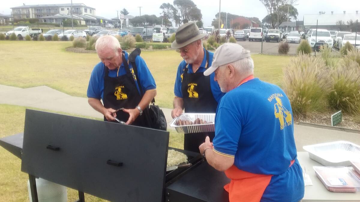 Volunteers cooking at the PCYC charity golf day.