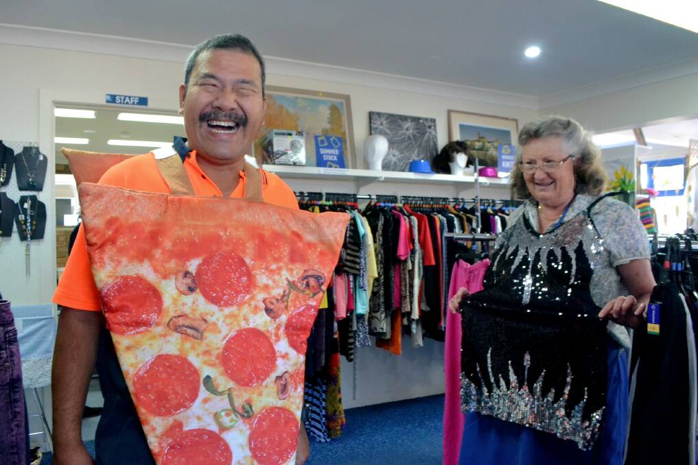 PIZZA MAN: Narooma Vinnies volunteers love to have a laugh when putting new stock out on the floor. 
