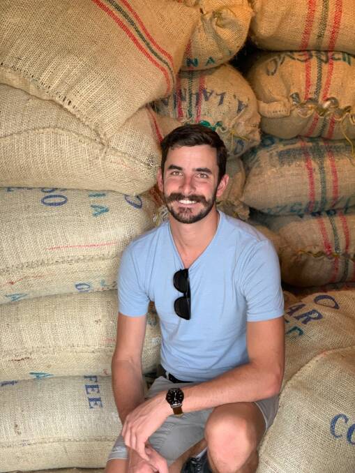 Coffee aficionado Sam Steiner of Alfresco Coffee Roasters with coffee beans from Columbia. 