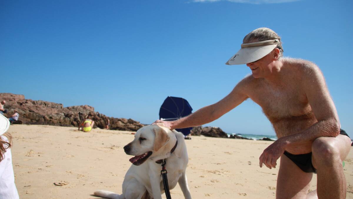 Robert Dunn and his Labrador Monty at the beach.