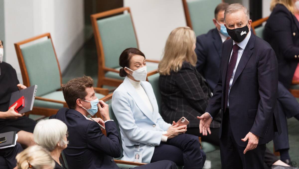 Prime Minister Anthony Albanese speaks to independents shortly before the government's climate bill was passed in the House of Representatives. Picture: Sitthixay Ditthavong