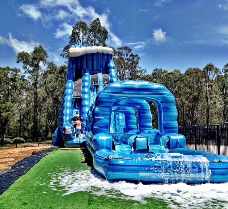 HOLIDAY FUN: Kiama Makers and Growers Market will feature a giant waterslide on Saturday, December 23 from 11am-2pm (market 10am-4pm) at Black Beach, Kiama. Come join the fun!