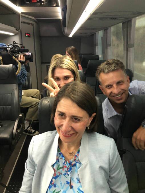 Happier days during the 2019 NSW state election: Mary photobombs her sister Premier Gladys Berejiklian with Transport Minister Andrew Constance also joining in the fun on the Liberal campaign bus in March 2019. Photo: Lisa Visentin