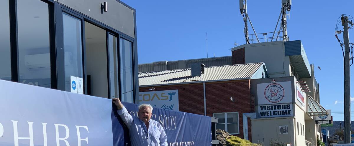 John Palasty, of Virtical at the sales office site, back in 2021 with the Telstra towers in the background prior to the Fishermen's Club's demolition. Photo supplied