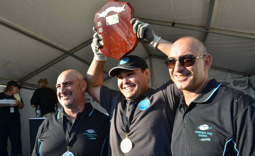 Champion oyster shucker Gerard 'Doody' Dennis (centre) with runner-up Jim Yiannaros (left) and John Yiannaros at the 2018 Narooma Oyster Festival. John Yiannaros has rejected claims Australia's Oyster Coast unfairly dominates the industry on the South Coast.