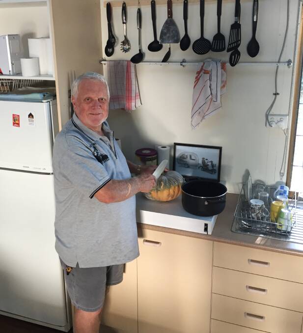 COLD COMFORT: The Men's Shed's Geoff Broadfoot gets started on a nourshing meal but tempers are simmering as sheddies struggle to find new site.