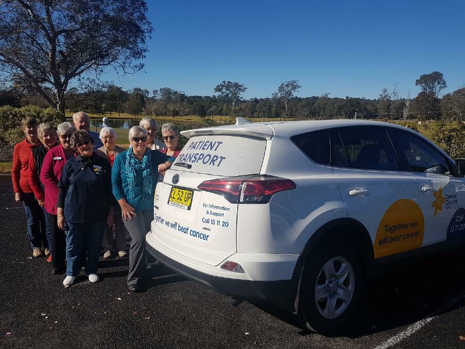 SPECIAL DELIVERY: Eurobodalla Transport to Treatment volunteers (left to right) Rosemary Mylott, Jenny Tweedie, Carlien Donnan, Pat Eaton, John Armstrong, Jan Tonks, Lyn Jordan, Shayne McArthur, Kathy Roberts with the new patient transport car.