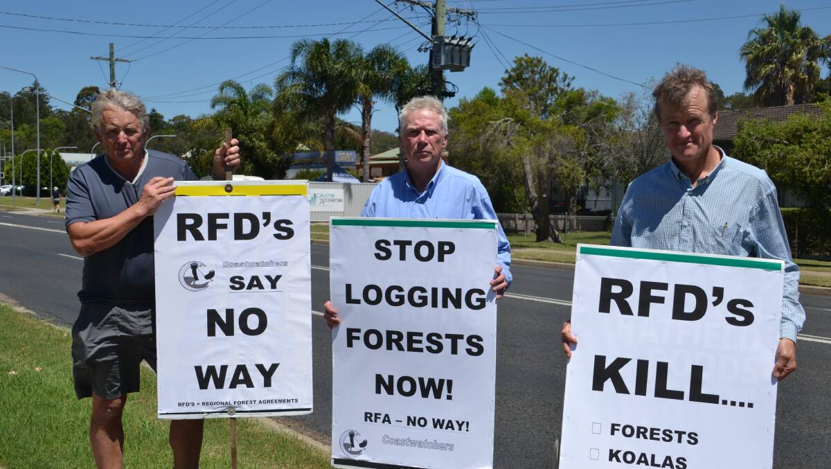 FOREST RALLY: John Perkins, Noel Plumb and Mark Rote of Coastwatchers protest native forest logging in Batemans Bay on Wednesday.