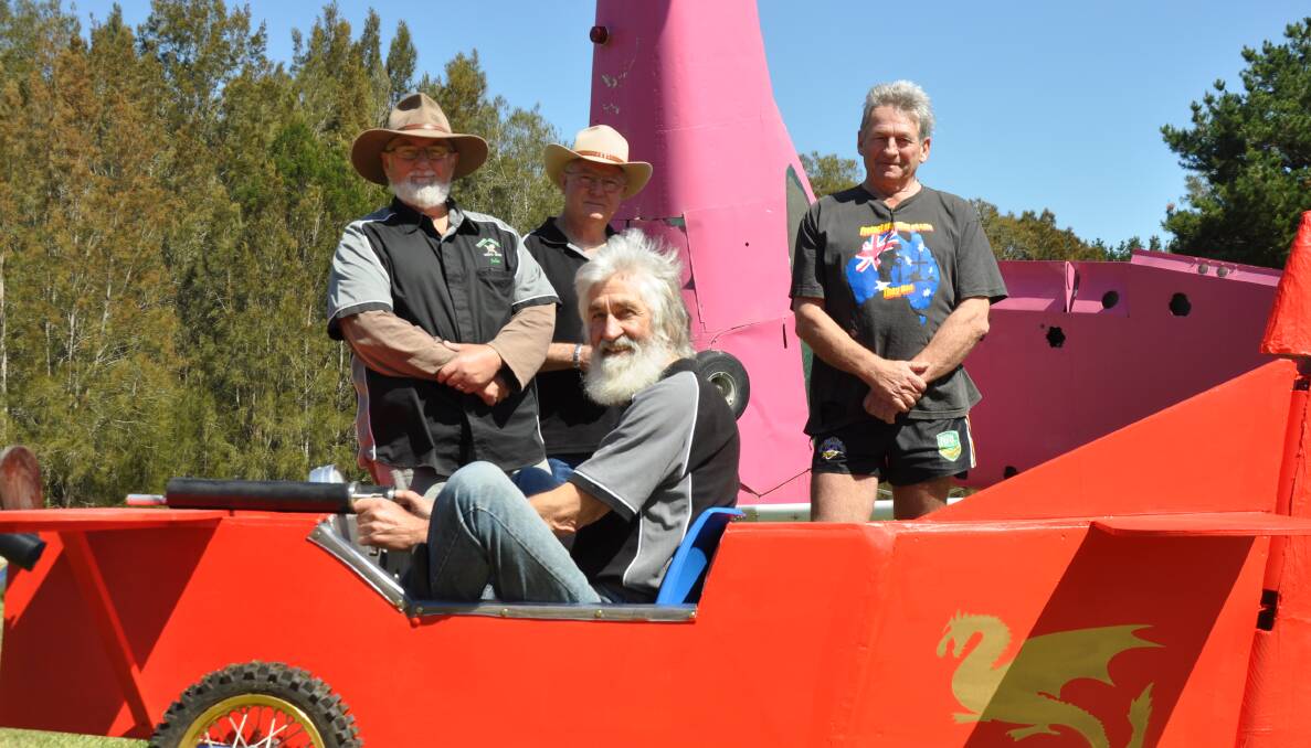 TOUCH DOWN: Allan Newhouse (front) flies into Coila with fellow Tuross Head Men's Shed members John Harvey, Wayne Brockman and Coila Auto Centre's Pete Ward.