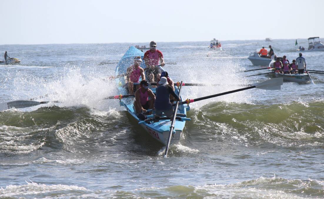 Seven-day-cruise: The Tathra men's crew make a splash launching off Merimbula in a previous George Bass Surf Marathon. 