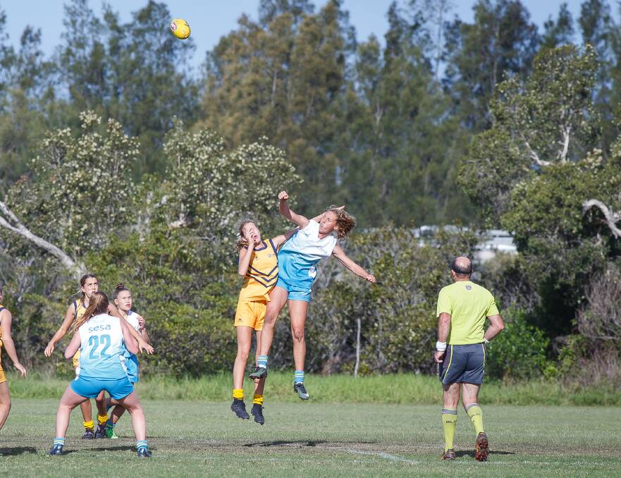 High flyer: Tarni Evans flies high out of the ruck during a representative clash for SESA, where she was named Players' Player and Player of the Year. Picture: Kevin Bull