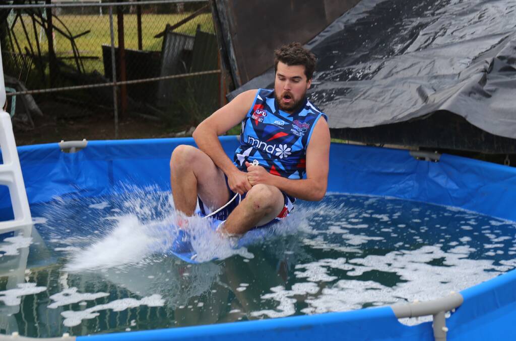 Merimbula captain Daniel Worden was the first to embrace the frigid pool as part of the combined Diggers-Lions MND fundraiser round. 