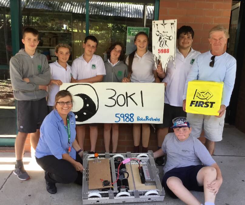 COMPETITION READY: Narooma High School robotics team and their robot "Aoki" ready to compete. Pictured are Adam Bevington, Josh Ryan, Will Dawson, Hayes Cramb, Abbey Dawson, Connor McCarthy, Laurie Sargeant, and (front) teacher Gayle Allison and Andrew Baker. 