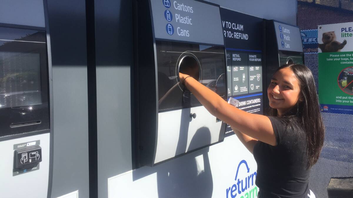 NAROOMA RETURN: Crystal Elmasri returns her containers to the Return and Earn reverse vending machine at the Narooma Plaza shopping centre.  
