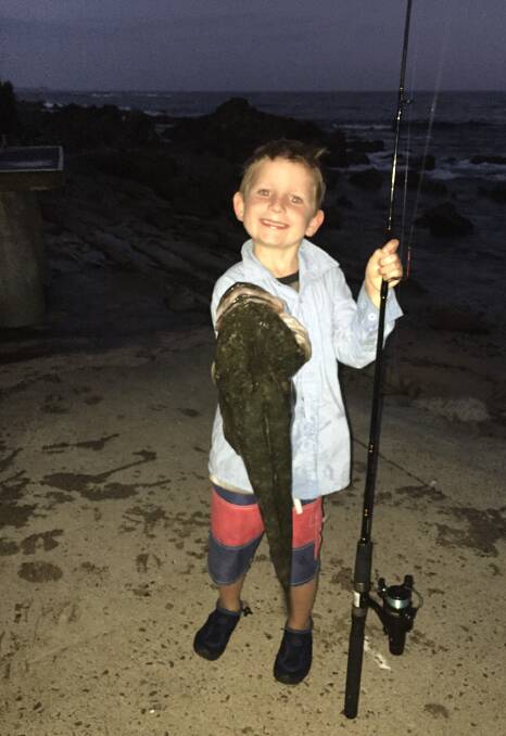 Luke Mitchell and his 75cm flathead caught on his new fishing rod. 