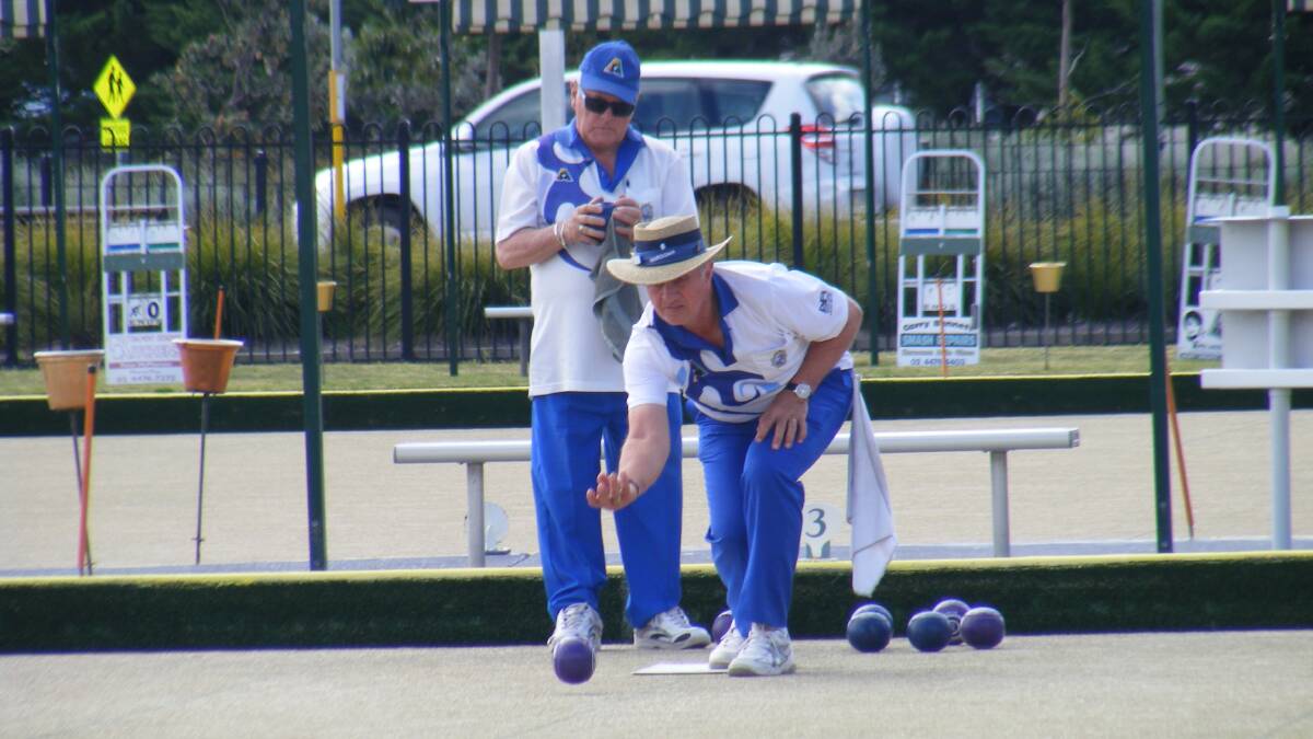 FINALS BOWL: Narooma bowler John Voytas delivers his bowl while Paul Read contemplates his shot during the Narooma Men's Bowling Club recent Minor Pairs Final.