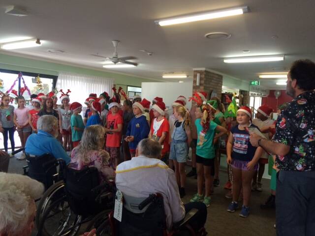 LOVELY FINISH: Narooma Public School ended the year’s visits to IRT Dalmeny by singing Christmas Carols with residents.