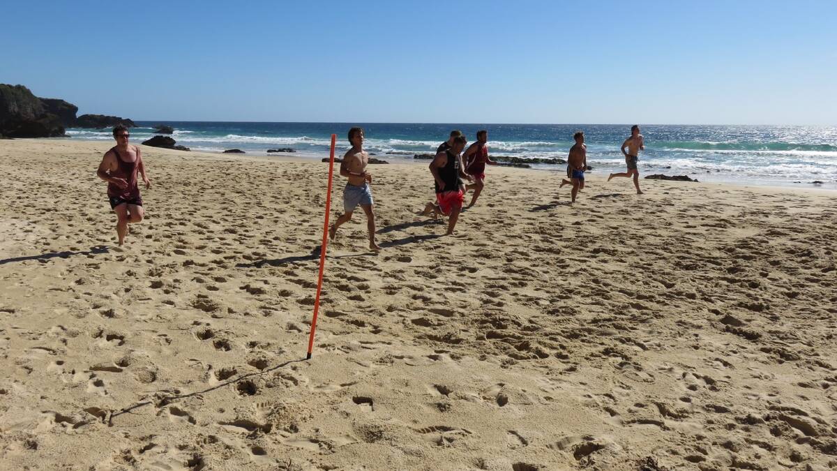 Narooma Devils putting in the beach sprints.  