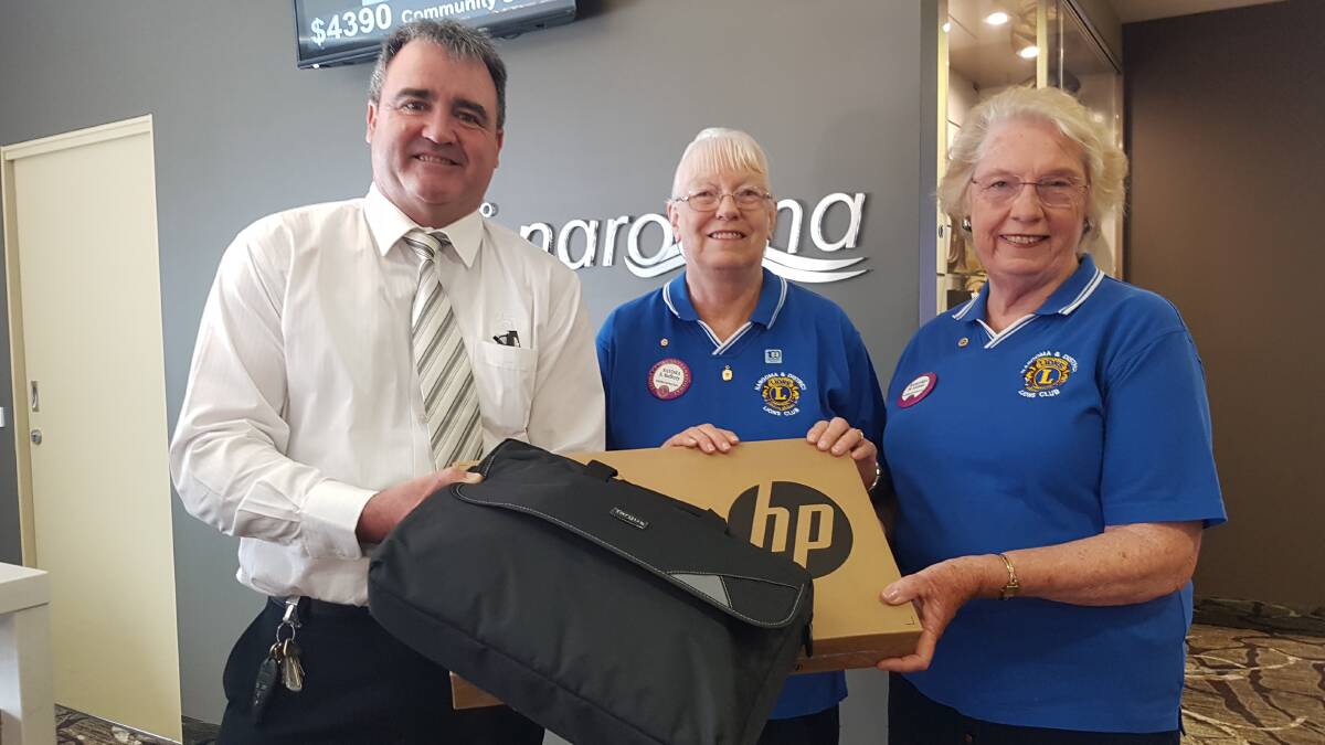 COMPUTER DONATION: NSSC CEO Tony Casu with the new computer and the Narooma Lions' president Margaret  Latimer and secretary Sandra Rafferty.   