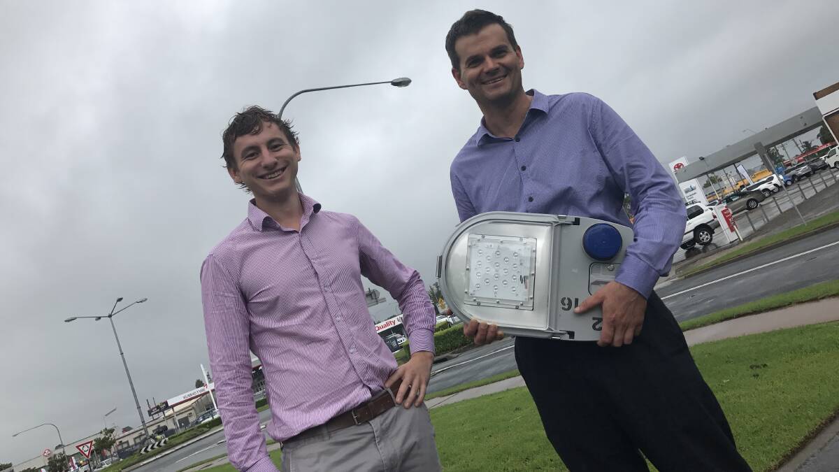 Essential Energy engineer Sam Peake and the council's Sustainability Coordinator Mark Shorter with one of the new LED street lights set to be installed.  