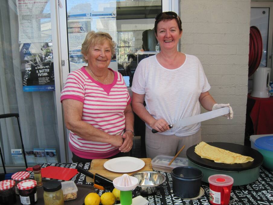 DELICIOUS PANCAKES: Margaret Osborne and Patricia Coutant the French crepe lady at the Max Employment Odd Socks Day event. 