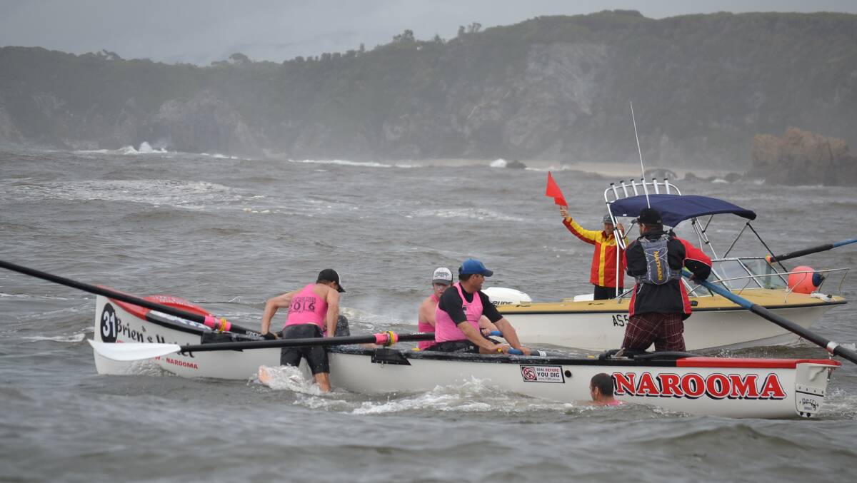 CREW CHANGE: The Narooma rowers do a crew change on their way into Bermagui on a leg of the 2016 race that was reversed due to rough weather. Head down to Narooma surf beach on January 2 and 3 to see all the action.