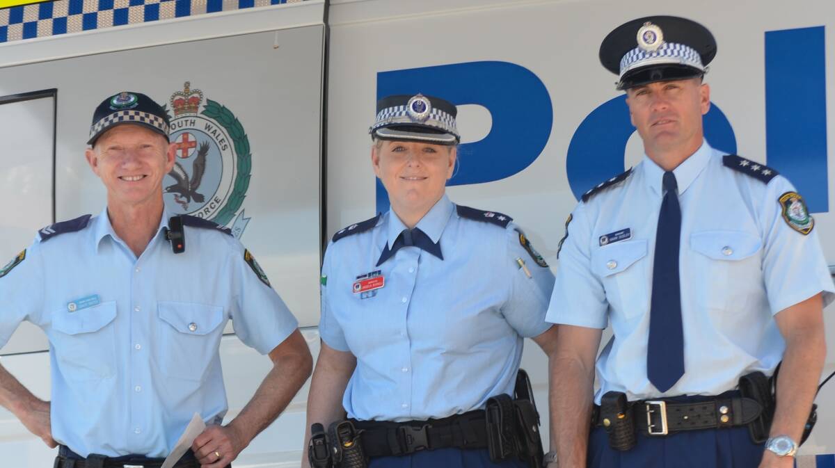 Far South Coast Local Area Command officers Senior Constable David Bates, Inspector Angela Burnell and acting Inspector Mark Dudley at the security stall at Batehaven on Tuesday. 