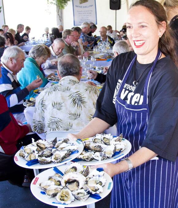 Sampling the delights at one of the previous Narooma Oyster Festivals.   