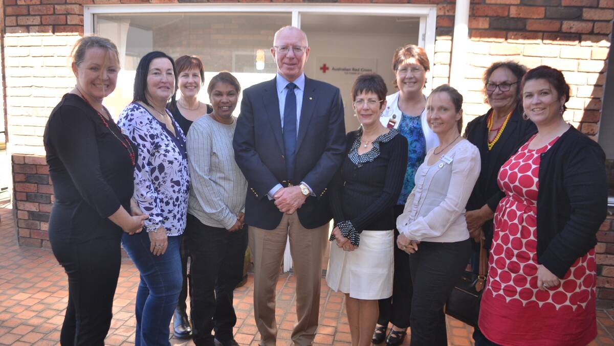 RED CROSS: NSW Governor David Hurley and his wife Linda at the Red Cross Narooma hub with Liz Ruck, Lee Barham, Julie Kirk, Cathy Thomas, Debbie Fisher, Rachael Niemoeller, Vivian Mason and Ally McQueen.
