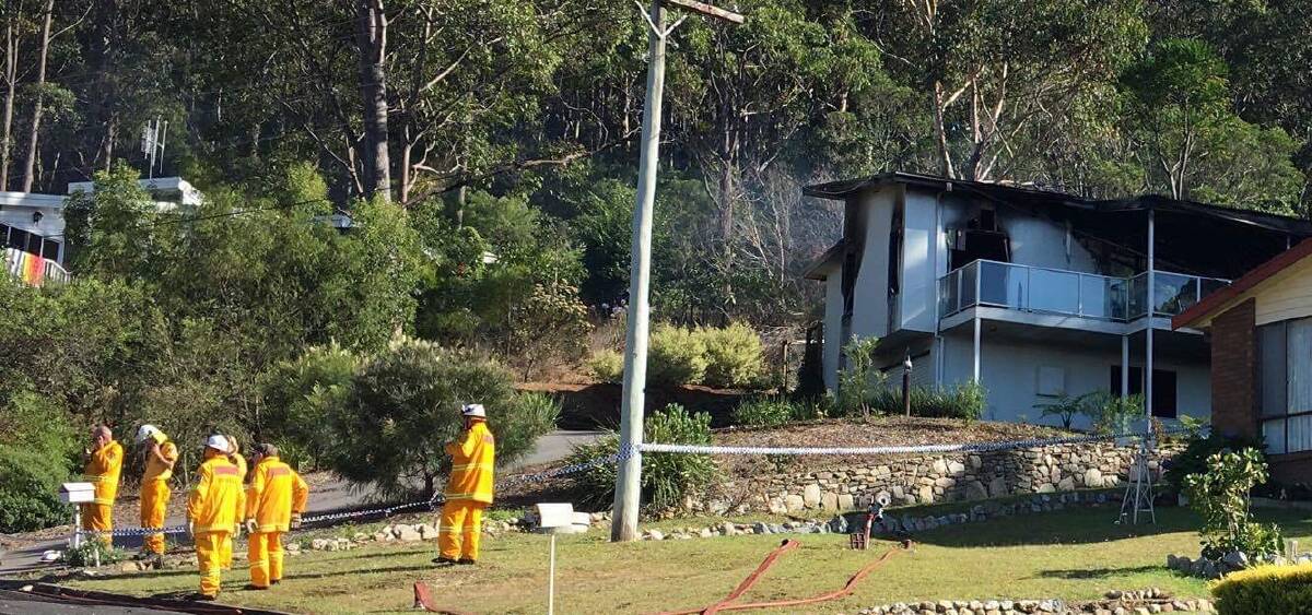 Narooma and Dalmeny RFS brigade volunteers at the scene of the destructive house fire on Fisherman's Crescent last Wednesday morning. Photo supplied.  
