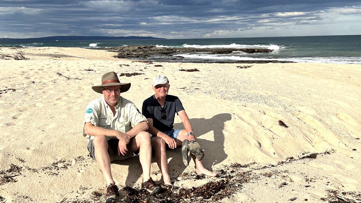 Tim and Allen Mawer contemplate the plight of the Walter Hood on the beach near her watery grave. Picture by Martine Bright