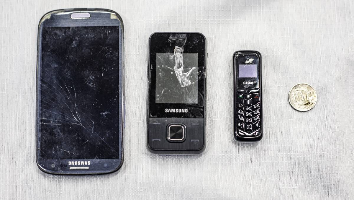 Some of the mobile phones found in the prison during previous searches. Picture: Sitthixay Ditthavong