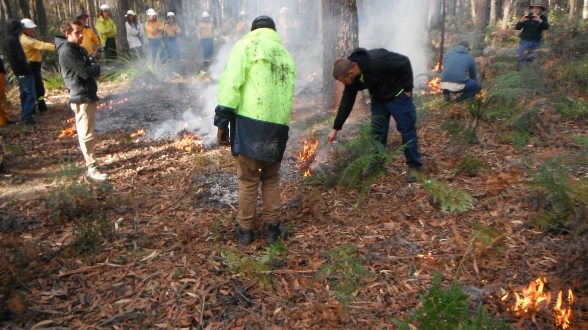 TRADITION: Bega Local Aboriginal Land Council members working with Rural Fire Service and local fire management experts to light up a cultural burn at the 60 hectare Wallagoot property.
