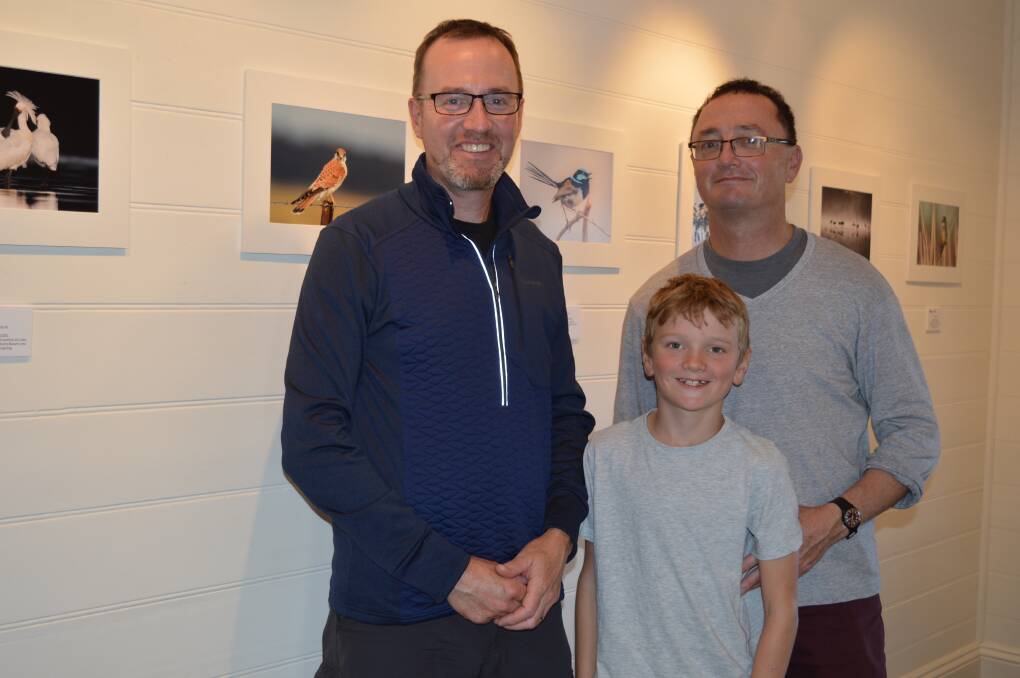 Greens MP David Shoebridge with his brother Micheal and nephew Dom checking out the photos on display at annual Animals in the Wild Photographic Exhibition.